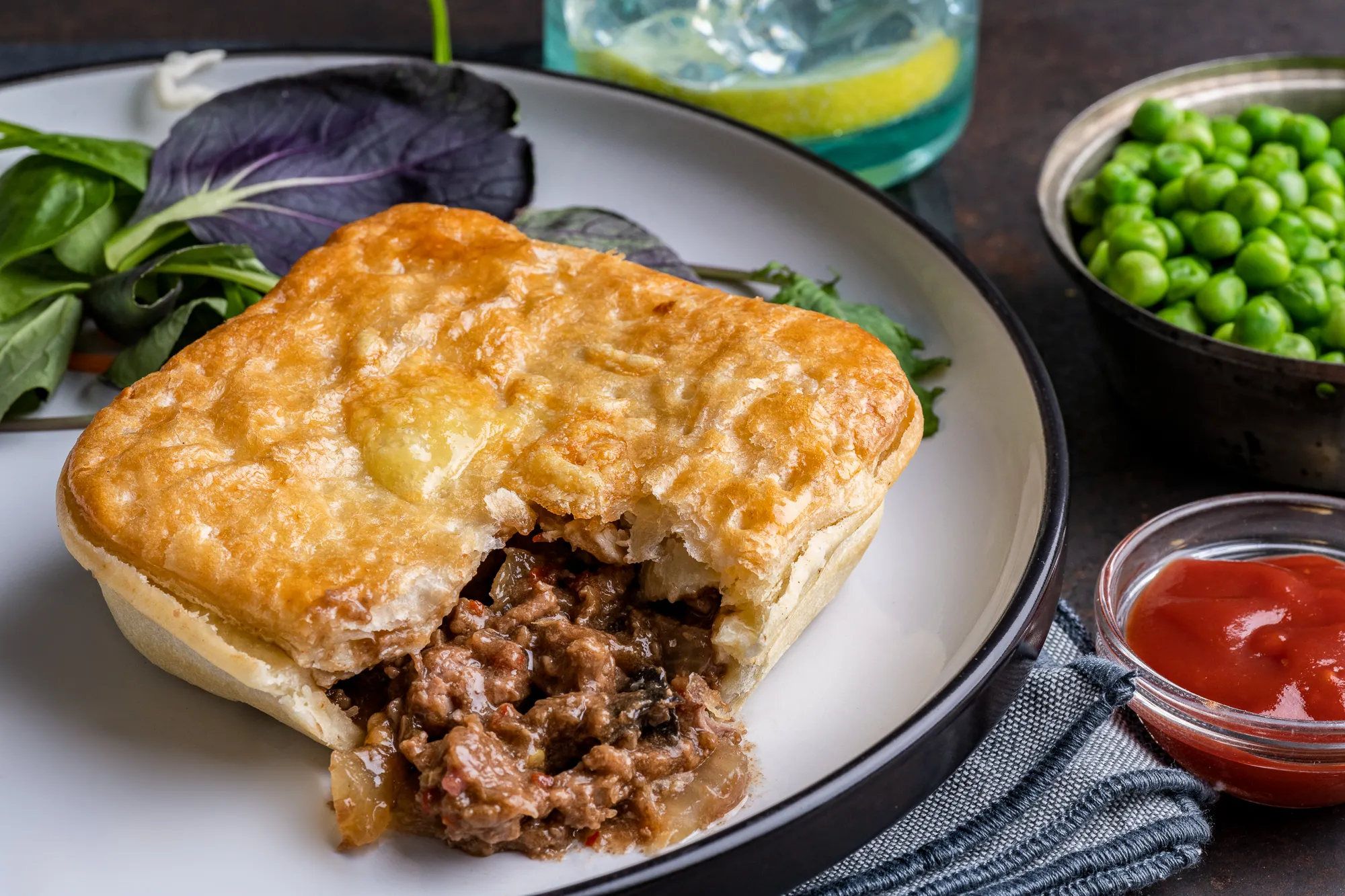 Steak pie cut open showing chunky filling